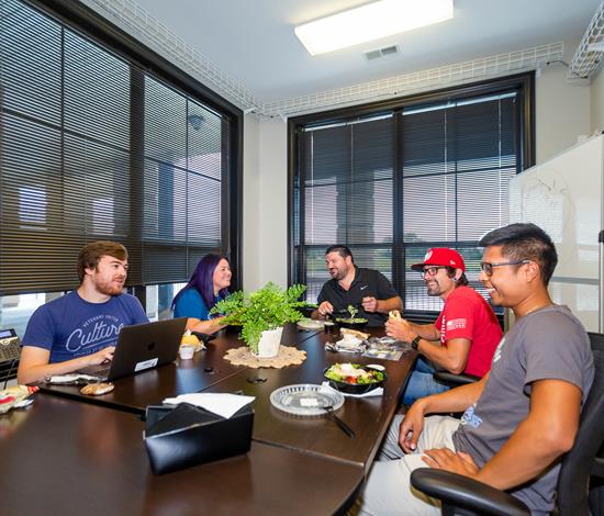 A group of people eating lunch together