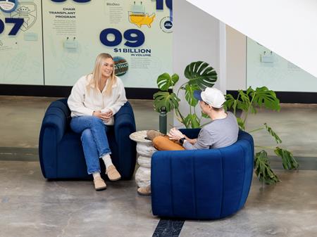 Two people chatting in Jake Atrium