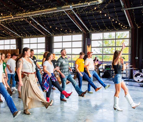 group of people line dancing