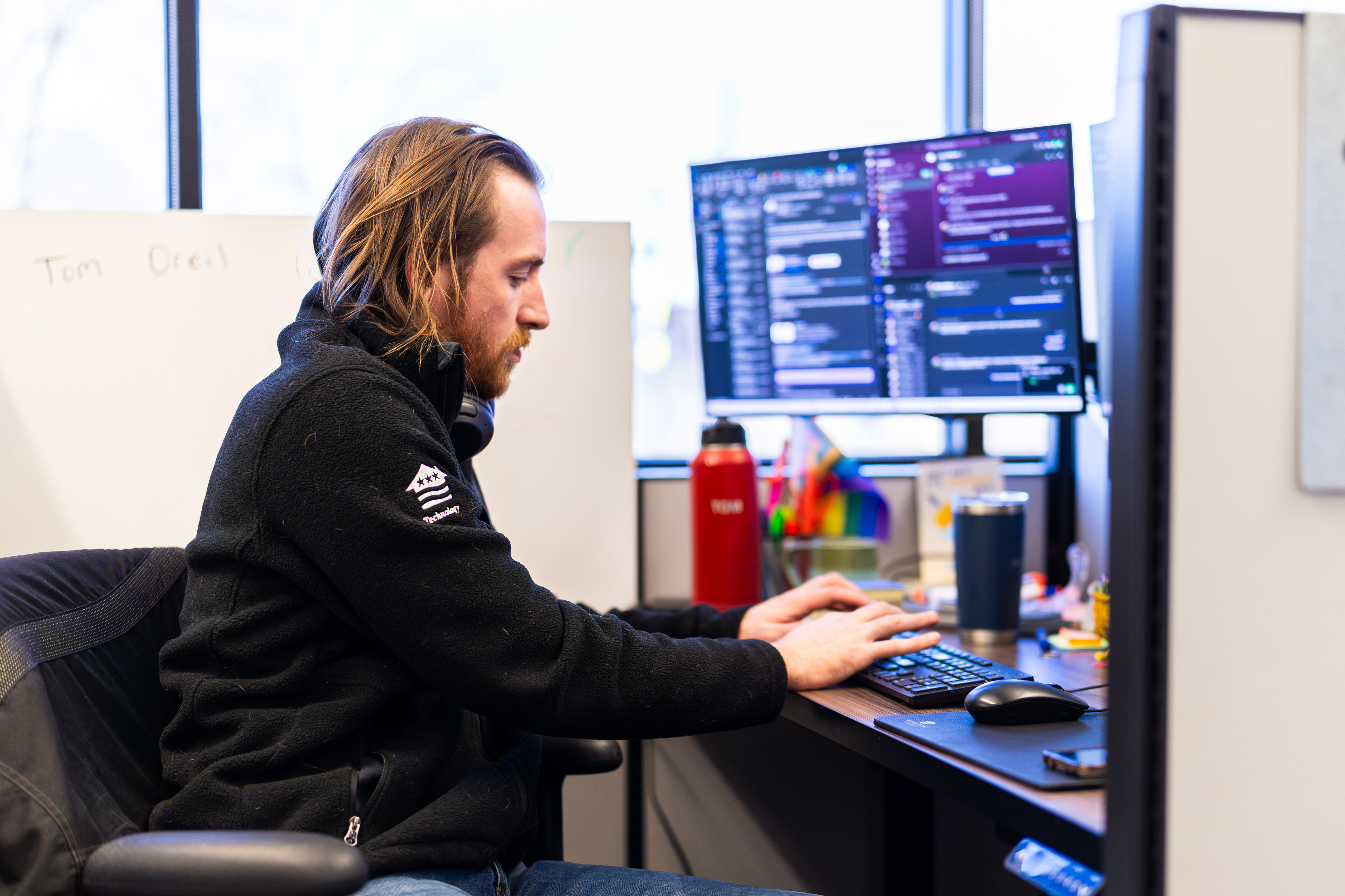 man in technology working on computer