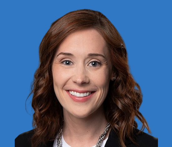 A smiling woman with brown hair