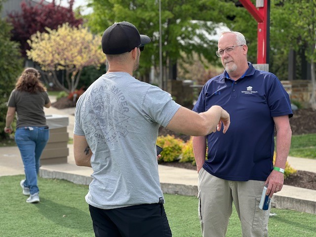 Two men talking to each other