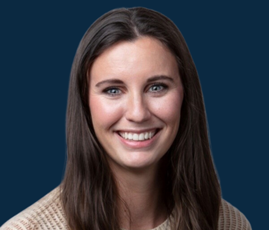 A smiling woman with long dark hair (1)