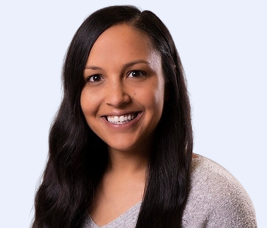 A smiling woman with long dark hair