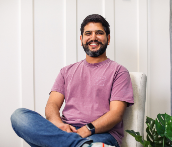 A smiling man with facial hair